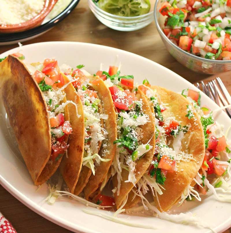 Crispy potato tacos with toppings & cheese by the Colorado Potato Administrative Committee